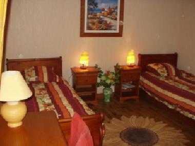 La chambre avec les 2 lits simples