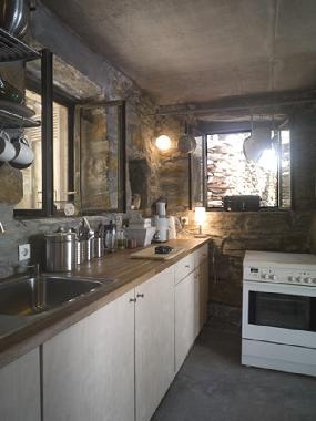 The kitchen is in the back of the house