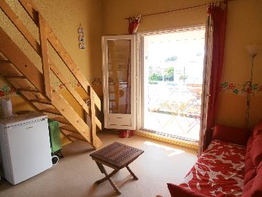 La piece commune et le balcon